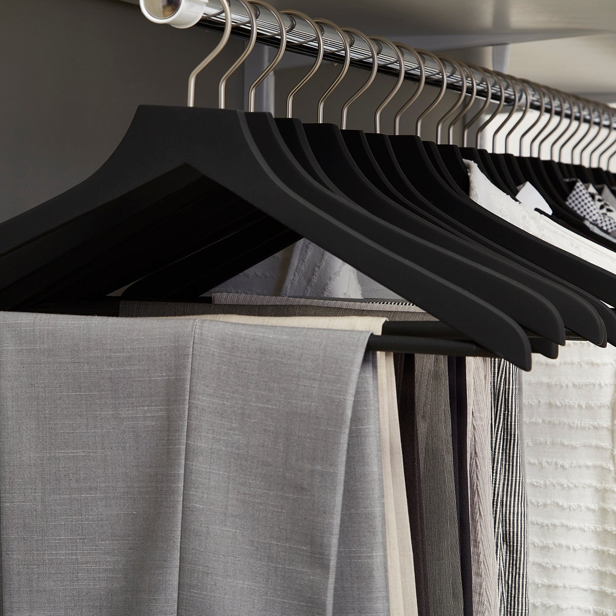 gray wooden hangers