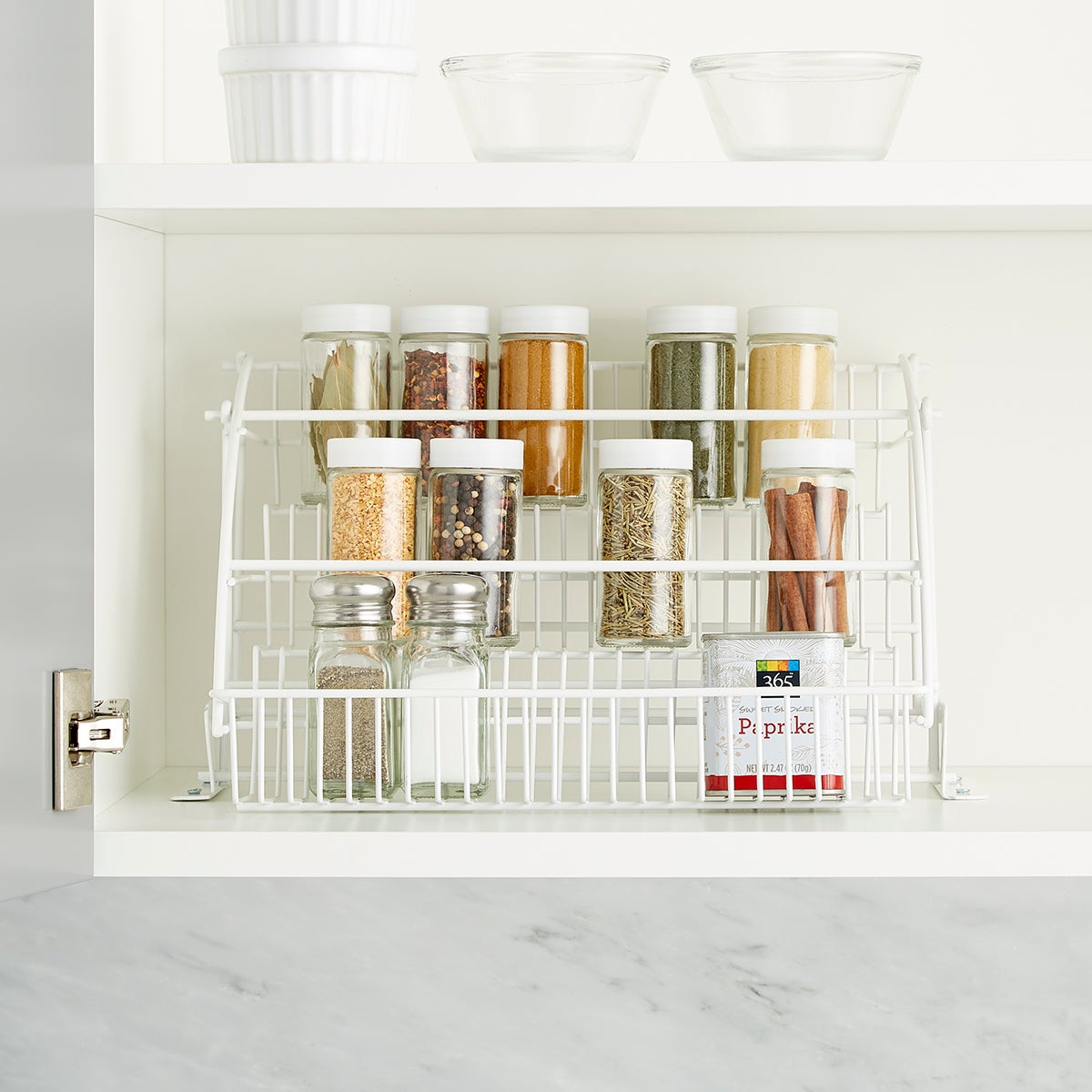 I made a pull-out spice rack to organize all our spice jars