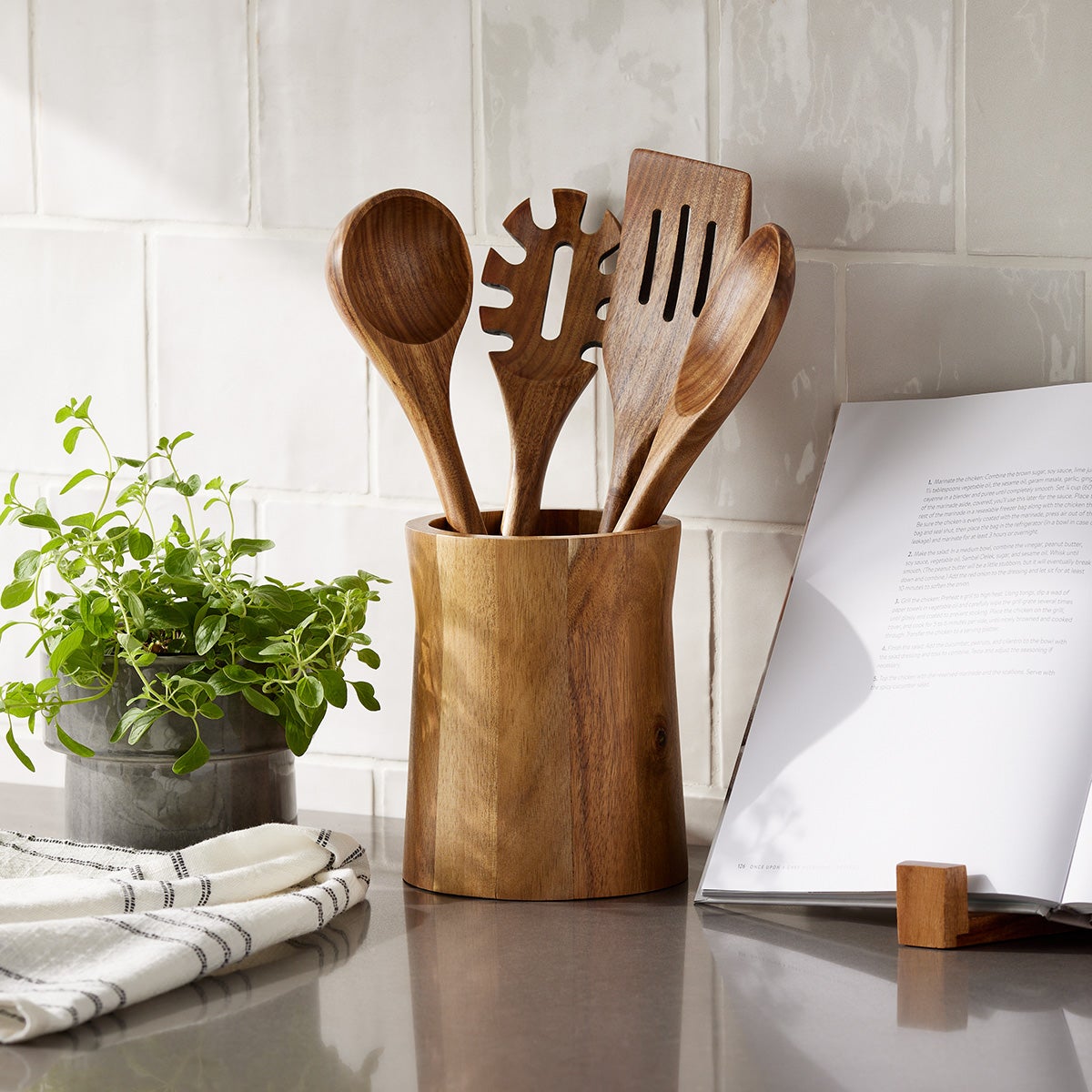 This $10 Paper Towel Holder Sticks Onto The Wall And Saves Counter Space