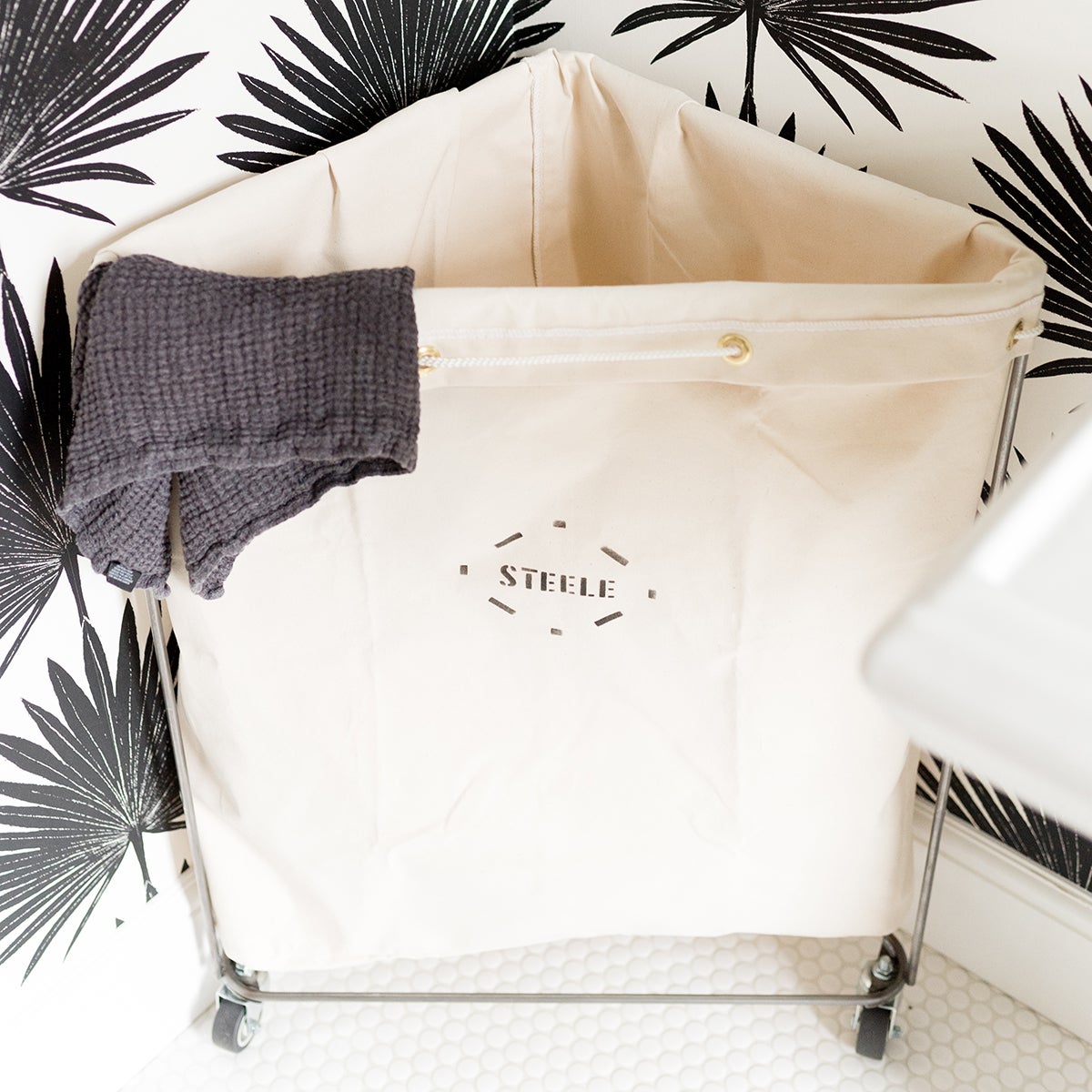 Steele Canvas Corner Laundry Cart The Container Store